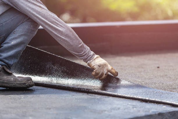 Professional Basement Waterproofing technician working in Gladwyne, PA
